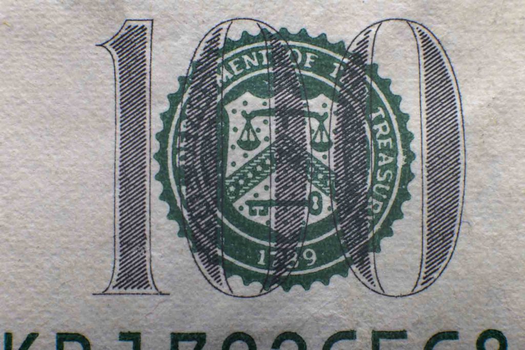 inscription on one hundred dollar closeup